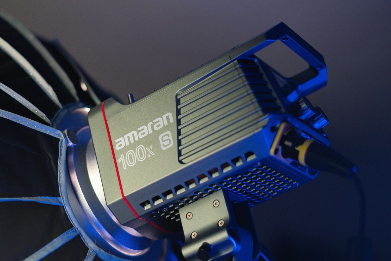 A detailed close-up of a Amaran 100x S bi-color LED studio lamp, perfect for professional lighting needs.